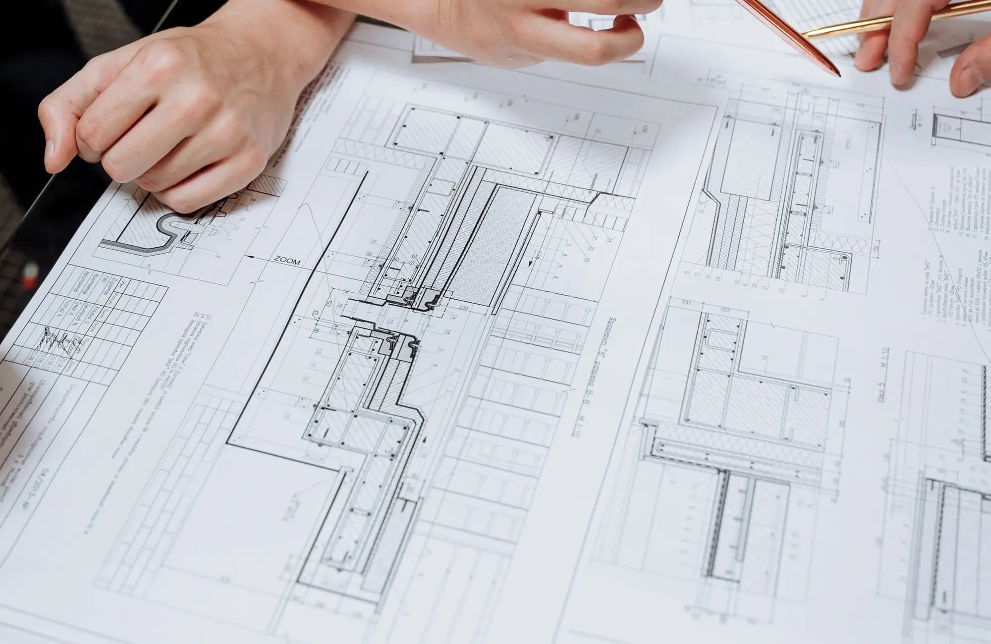 Facility drawings being marked up during a design review