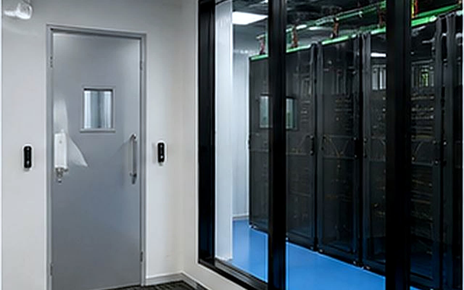 Glass-walled data hall from the access corridor